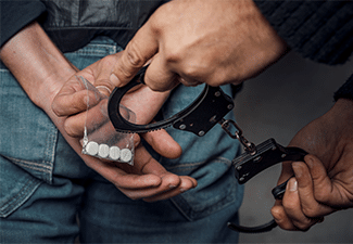 82934-police-officer-and-man-arrested-for-drug-possession-c7c27924.png
